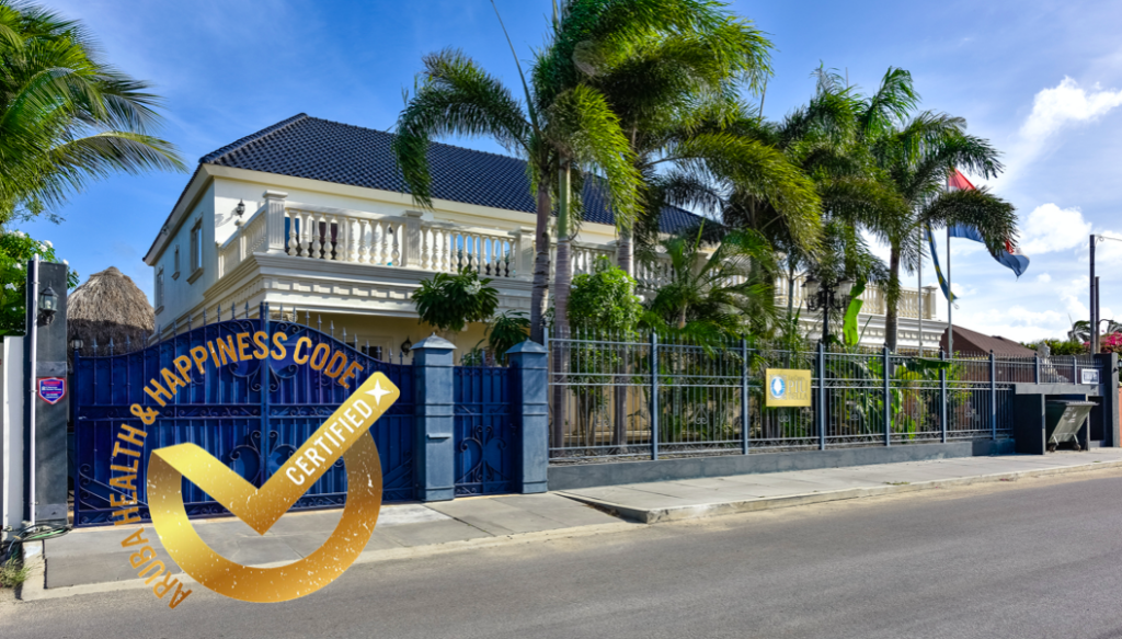 Inviting pool area at La Casa Piu Bella with tropical landscaping.